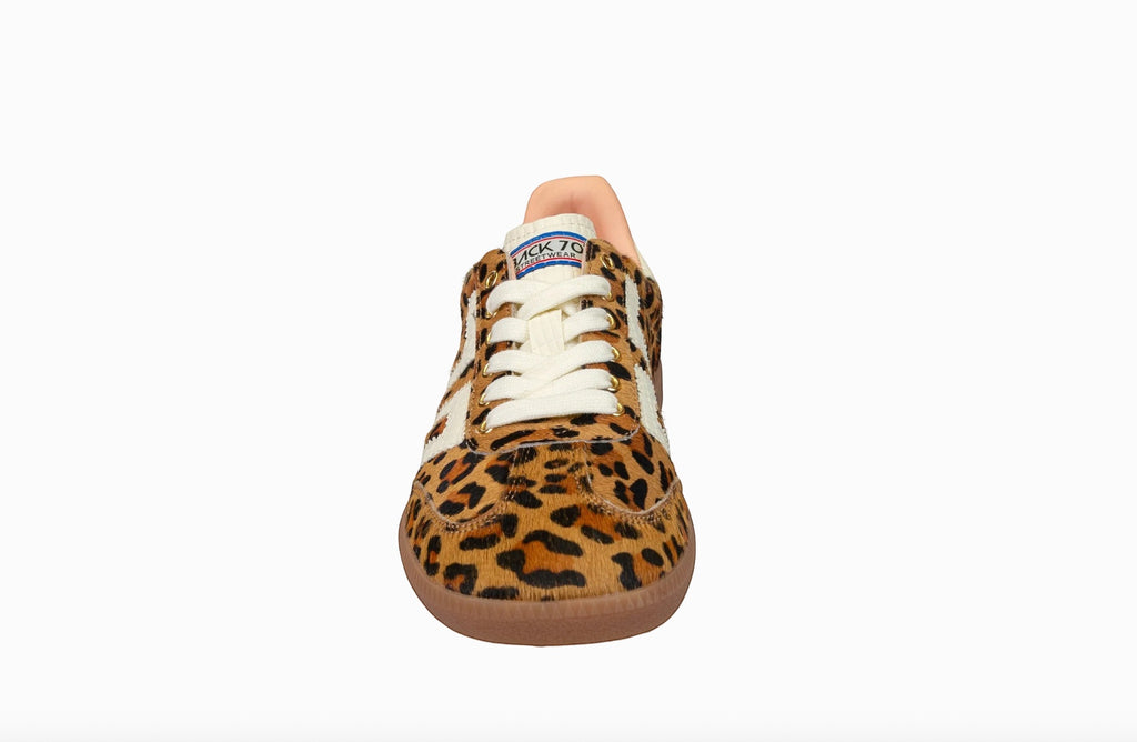 The Denim Bar women's leopard print leather and suede low-top sneakers with white laces and stitching.